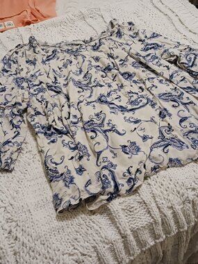 Cato top, cream with blue detailing.  It is a size 18/20